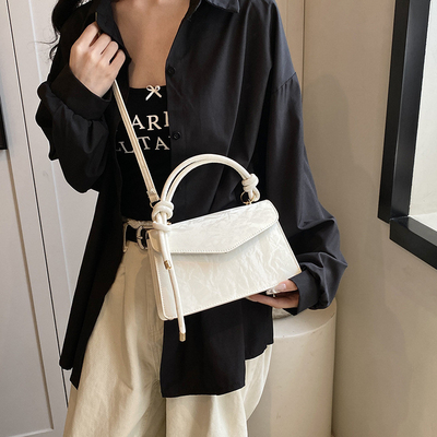 Tas Tangan Berkualitas Tinggi Wanita Tren Baru Mode NICHE Desain Hand Bill of Loading Bahu Tas Semua Tekstur Tas Crossbody